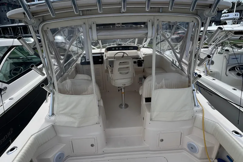  Yacht Photos Pics 2009 Grady-White Express 330 boat interior with helm and seating area.