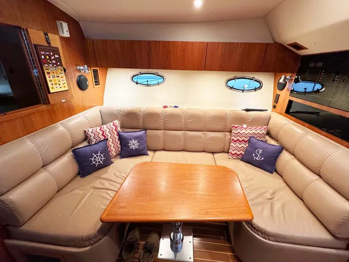 Rhumb Line Yacht Photos Pics Luxurious interior of 2000 Tiara Sport 3500 Open yacht with plush seating and nautical decor.