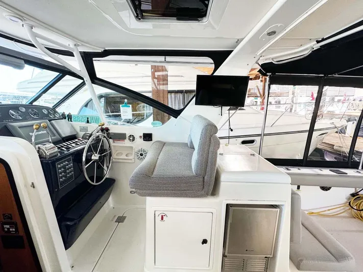 Rhumb Line Yacht Photos Pics Interior of 2000 Tiara Sport 3500 Open yacht with helm and seating area.
