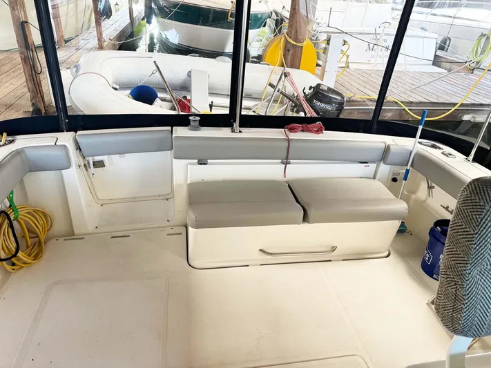 Rhumb Line Yacht Photos Pics 2000 Tiara Sport 3500 Open boat interior with seating and dock view.