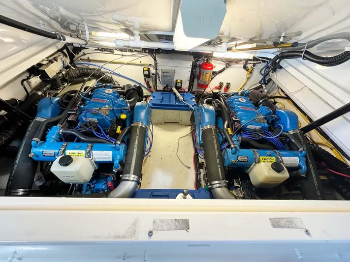 Rhumb Line Yacht Photos Pics Engine room of 2000 Tiara Sport 3500 Open with dual blue engines.