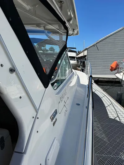 Rhumb Line Yacht Photos Pics 2000 Tiara Sport 3500 Open yacht docked at marina, side view.