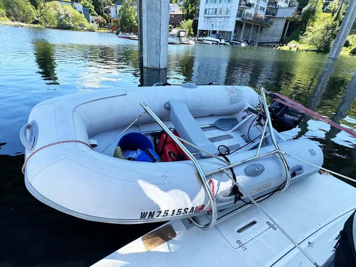 Rhumb Line Yacht Photos Pics Inflatable boat docked on water near Tiara Sport 3500 Open, 2000 model.