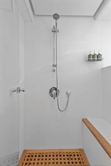 Archipelago Yacht Photos Pics Shower area in 2005 Moonen Displacement Yacht with wooden floor and wall-mounted toiletries.