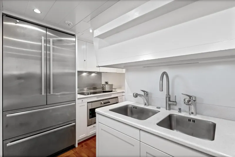 Archipelago Yacht Photos Pics Modern kitchen in a 2005 Moonen Displacement Yacht with stainless steel appliances.