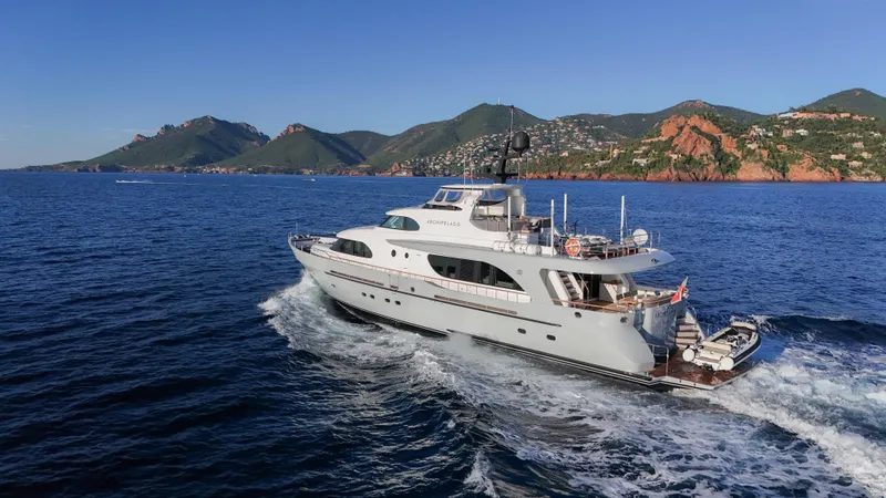 Archipelago Yacht Photos Pics Moonen 2005 Displacement Yacht cruising on open sea with scenic mountain backdrop.