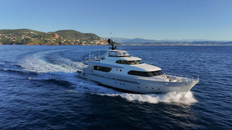Archipelago Yacht Photos Pics Luxurious 2005 Moonen Displacement Yacht cruising on open sea with scenic coastal backdrop.