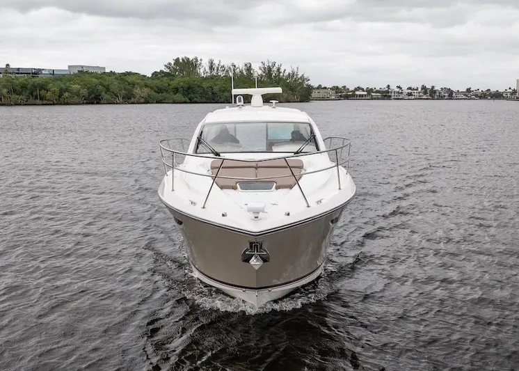 Scrappy G Yacht Photos Pics 2015 Pursuit SC 365i Sport Coupe cruising on a calm river under cloudy skies.