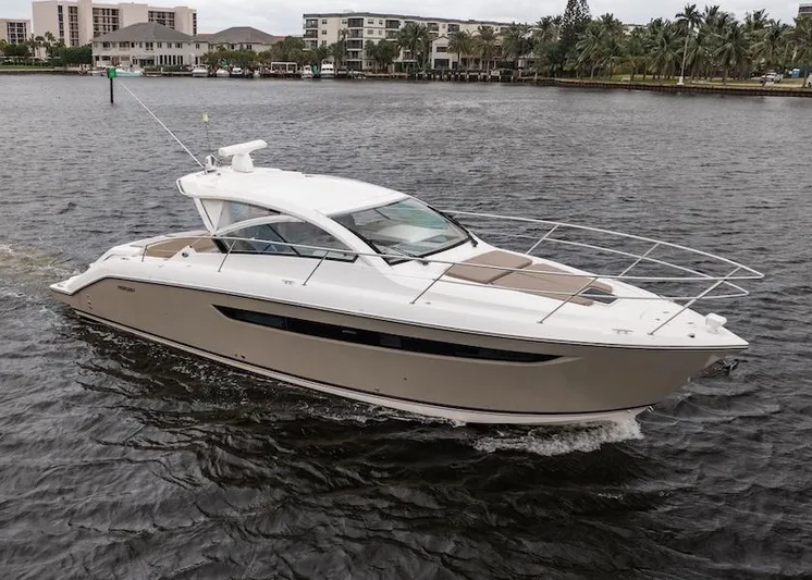 Scrappy G Yacht Photos Pics 2015 Pursuit SC 365i Sport Coupe cruising on a scenic waterway.