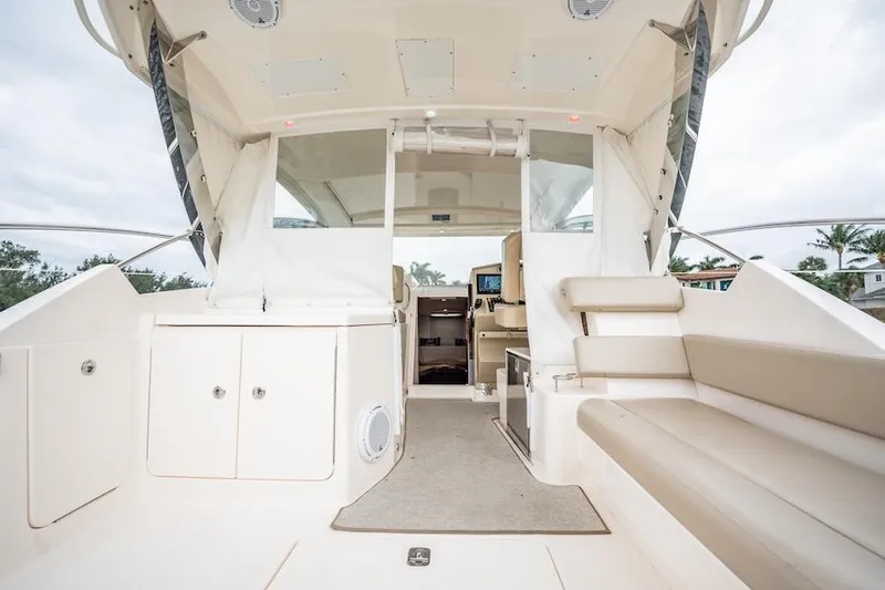 Scrappy G Yacht Photos Pics 2015 Pursuit SC 365i Sport Coupe interior with seating and helm view.