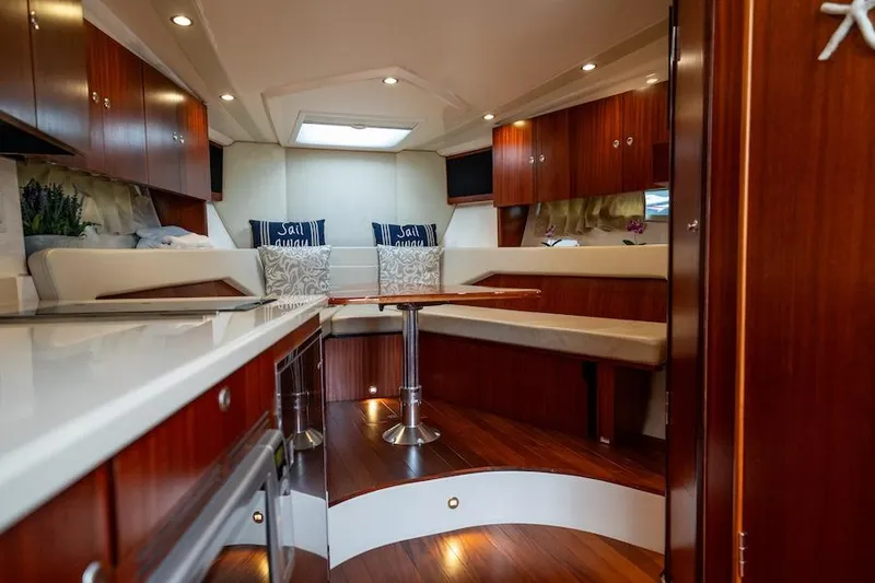Scrappy G Yacht Photos Pics Luxurious interior of 2015 Pursuit SC 365i Sport Coupe with elegant wood finishes.