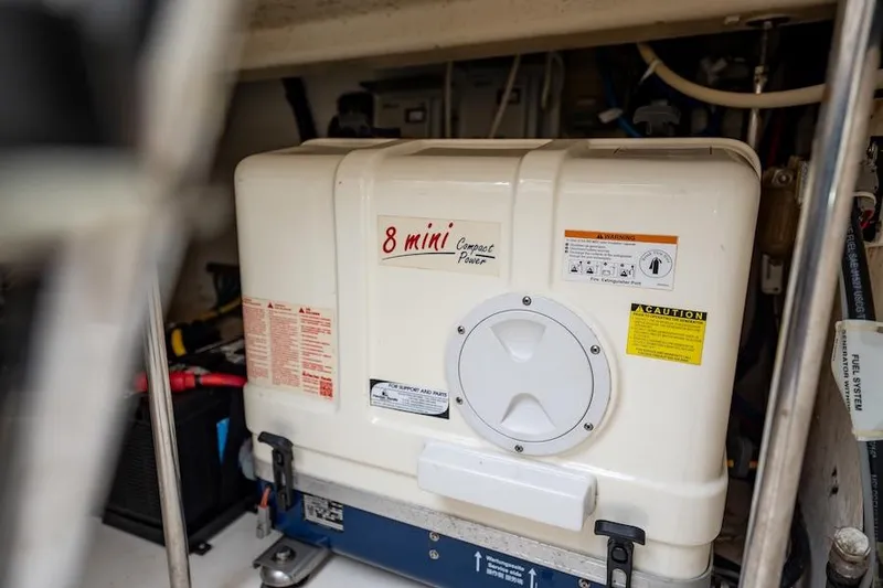 Scrappy G Yacht Photos Pics Engine compartment of a 2015 Pursuit SC 365i Sport Coupe with generator.