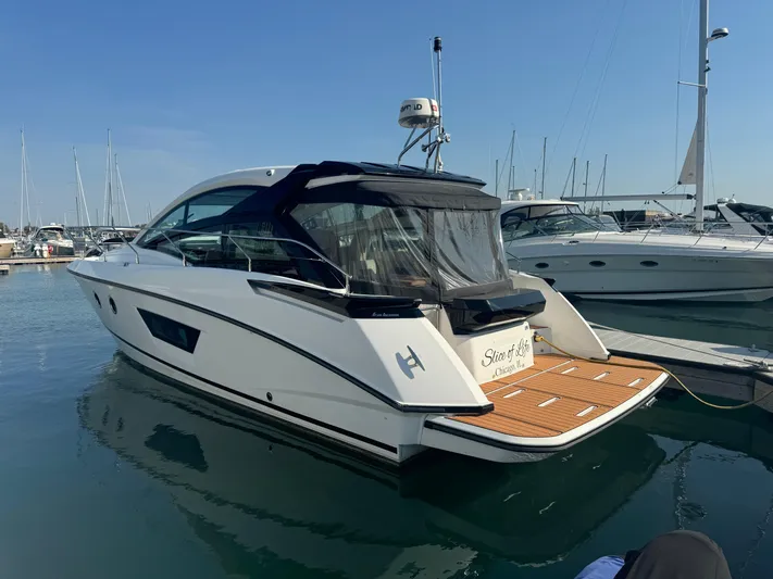  Yacht Photos Pics 2018 Beneteau Gran Turismo 40 yacht docked in marina, rear view.