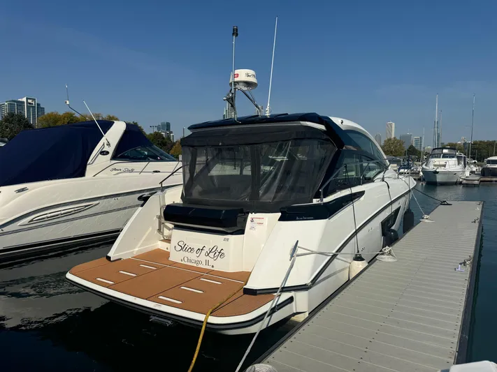  Yacht Photos Pics 2018 Beneteau Gran Turismo 40 yacht docked at marina, clear sky background.