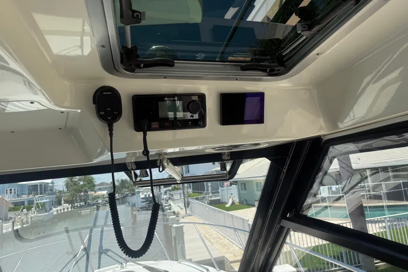  Yacht Photos Pics Interior view of 2021 Boston Whaler 325 Conquest boat with navigation equipment.