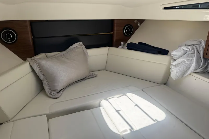  Yacht Photos Pics 2021 Boston Whaler 325 Conquest cabin interior with plush seating and modern design.