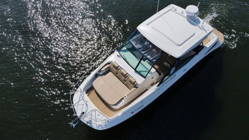  Yacht Photos Pics 2021 Sea Ray 320 Sundancer luxury boat on water, aerial view.