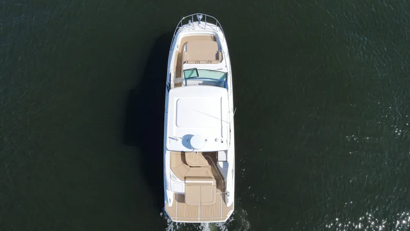  Yacht Photos Pics Aerial view of 2021 Sea Ray 320 Sundancer cruising on water.