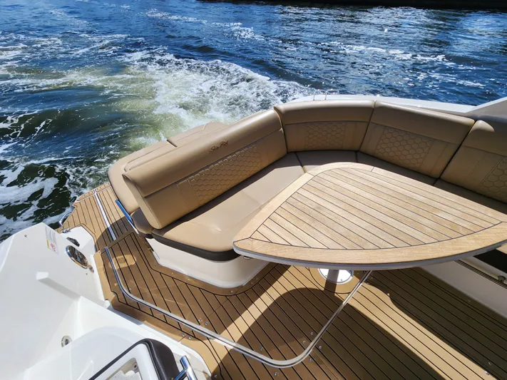  Yacht Photos Pics 2021 Sea Ray 320 Sundancer boat with teak deck and cushioned seating area.