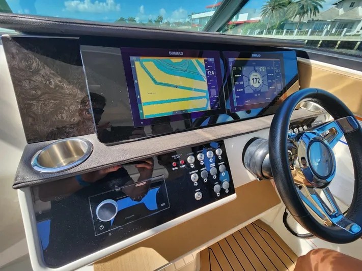  Yacht Photos Pics Helm of 2021 Sea Ray 320 Sundancer with dual Simrad displays.