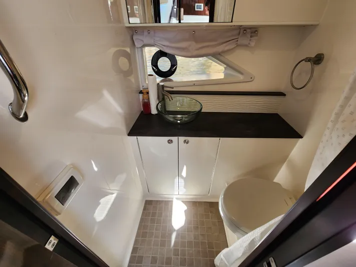  Yacht Photos Pics Modern bathroom in 2021 Sea Ray 320 Sundancer yacht with glass sink and toilet.