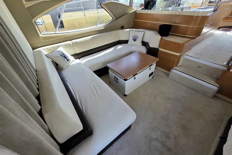  Yacht Photos Pics Luxurious interior of 2012 Azimut Fly 60 yacht with elegant seating and wooden accents.