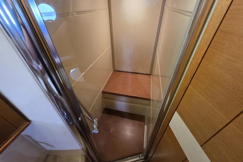  Yacht Photos Pics Shower area in 2012 Azimut Fly 60 yacht with wooden accents and glass door.