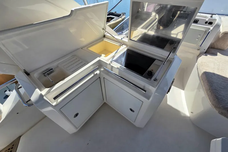  Yacht Photos Pics Luxurious 2012 Azimut Fly 60 yacht kitchenette with sink and stove.