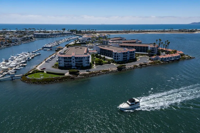Cynful One Yacht Photos Pics Aerial view of 1982 Viking 44 Motor Yacht cruising near coastal marina.