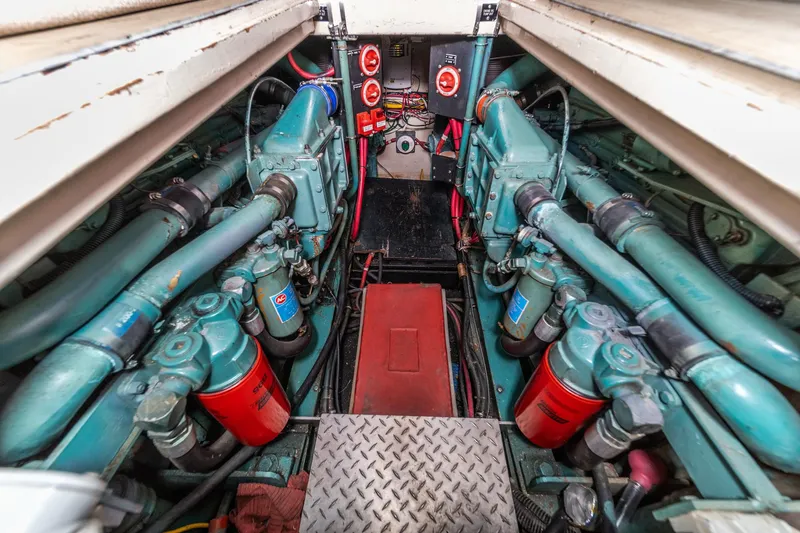 Cynful One Yacht Photos Pics Engine room of 1982 Viking 44 Motor Yacht with visible machinery and components.