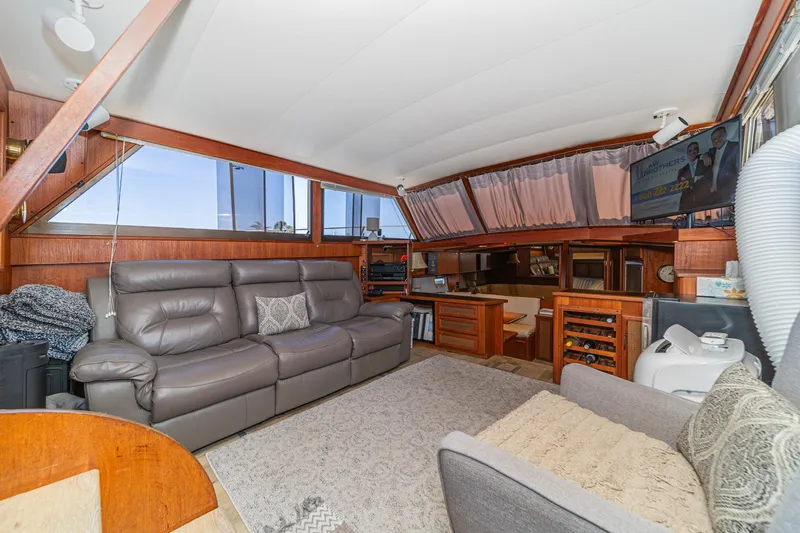 Cynful One Yacht Photos Pics Interior of 1982 Viking 44 Motor Yacht with leather seating and wood accents.