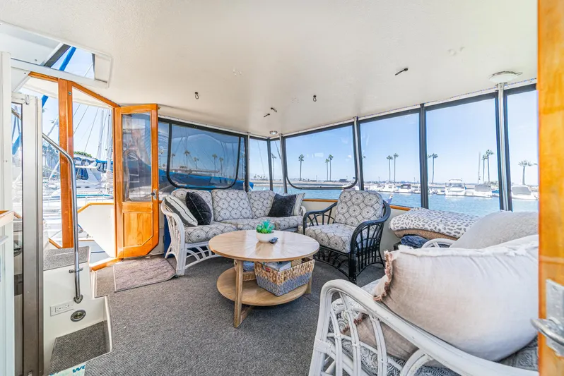 Cynful One Yacht Photos Pics Interior of 1982 Viking 44 Motor Yacht with elegant seating and ocean view.