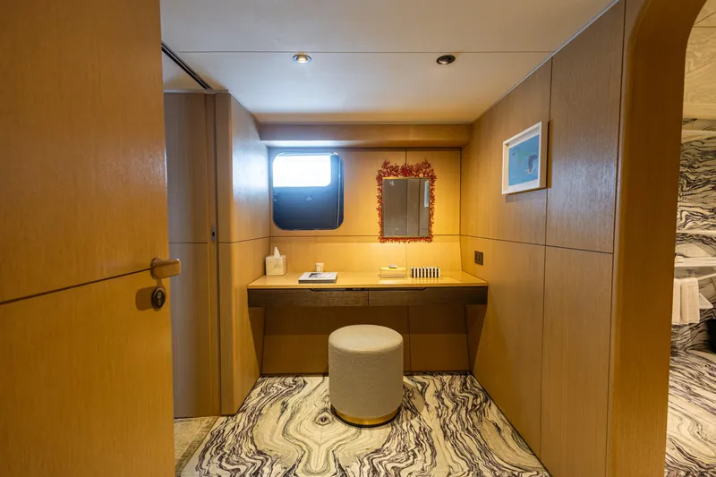 Grand Cru Yacht Photos Pics Luxurious interior of 1995 Baglietto 49M yacht with elegant wood paneling and marble flooring.