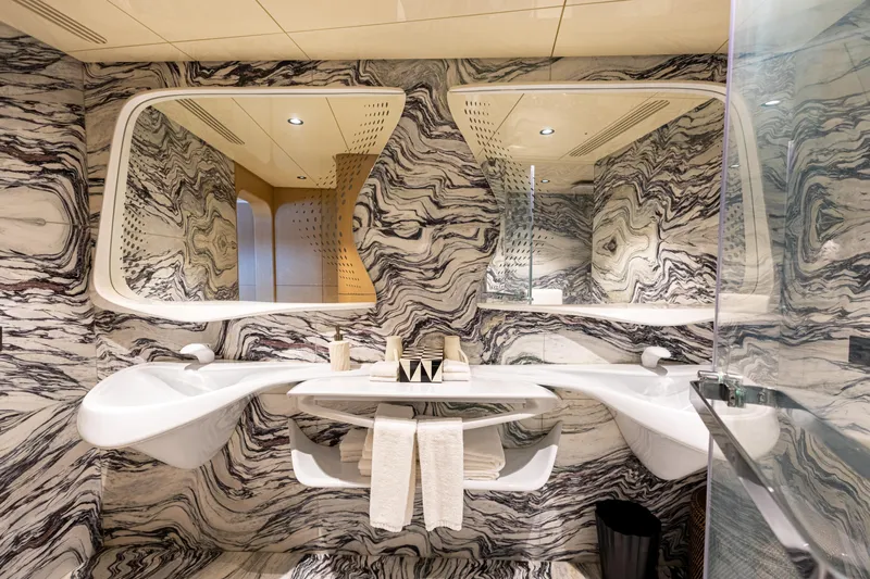 Grand Cru Yacht Photos Pics Luxurious marble bathroom interior on Baglietto 49M yacht, 1995 model, featuring elegant dual sinks.