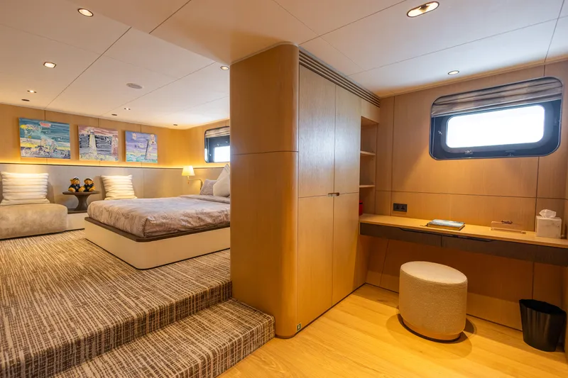 Grand Cru Yacht Photos Pics Luxurious interior of 1995 Baglietto 49M yacht with modern bedroom and elegant decor.