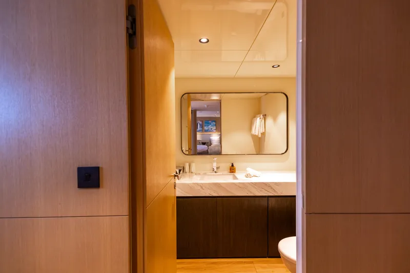 Grand Cru Yacht Photos Pics Luxurious bathroom interior on a 1995 Baglietto 49M yacht, featuring modern design elements.