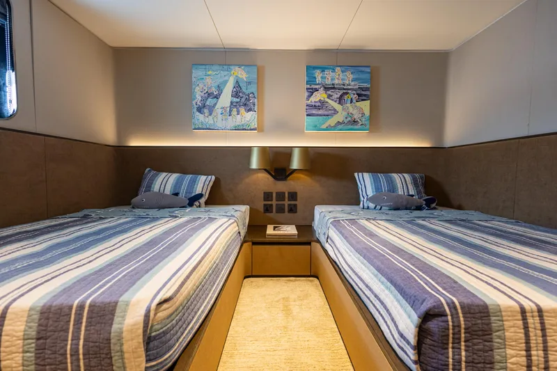 Grand Cru Yacht Photos Pics Twin beds in a cozy cabin on a 1995 Baglietto 49M yacht.