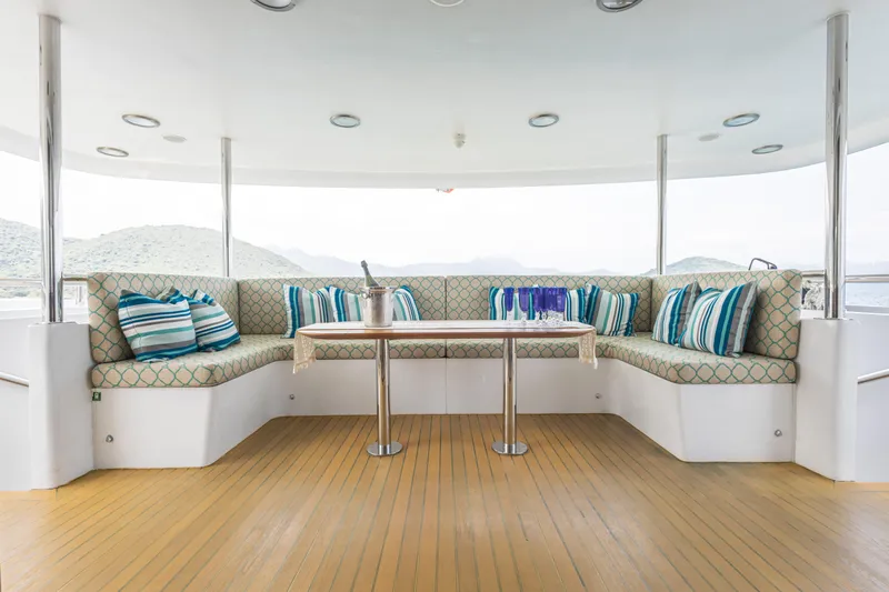 Grand Cru Yacht Photos Pics Luxurious seating area on 1995 Baglietto 49M yacht with scenic views.