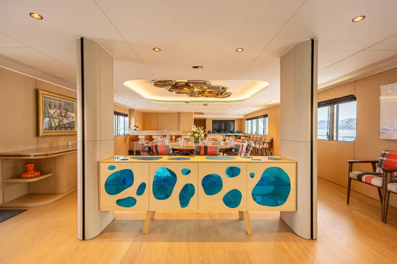 Grand Cru Yacht Photos Pics Luxurious interior of 1995 Baglietto 49M yacht with modern decor and elegant dining area.