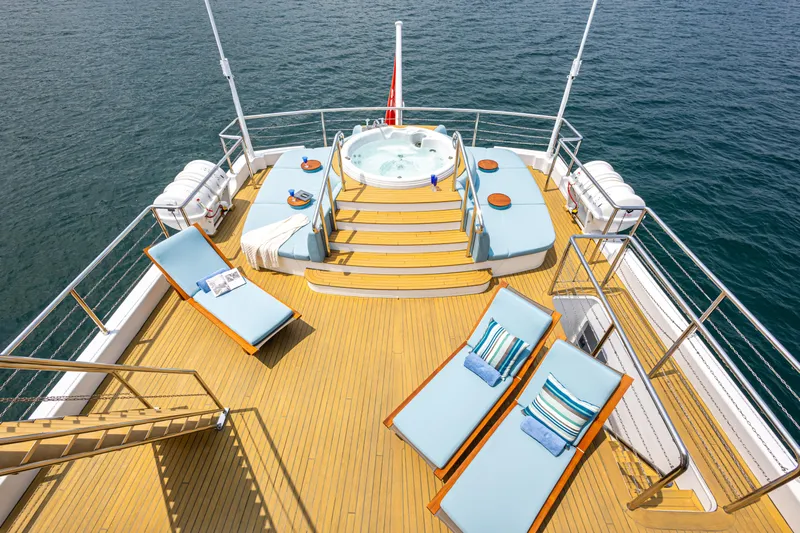 Grand Cru Yacht Photos Pics Luxurious deck of 1995 Baglietto 49M yacht with sun loungers and jacuzzi.