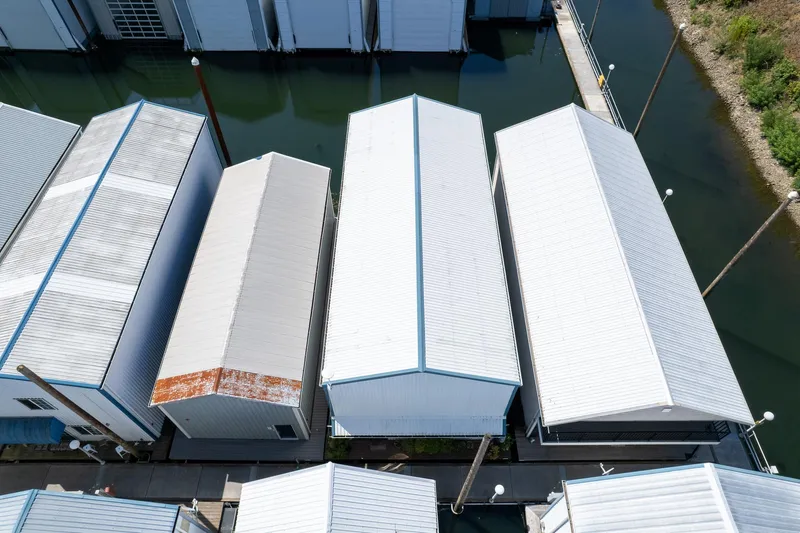  Yacht Photos Pics Aerial view of Steelhead Boathouse, 2006, with white roofs and water reflections.