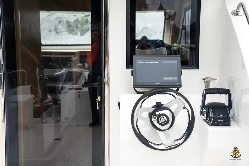  Yacht Photos Pics Interior of 2025 Bracewell Commander 36SF yacht with steering wheel and control panel.