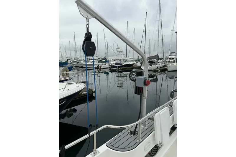  Yacht Photos Pics 2025 Bracewell Commander 36SF yacht at marina, featuring deck equipment and moored boats.