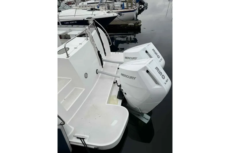  Yacht Photos Pics 2025 Bracewell Commander 36SF with dual Mercury outboard engines at a marina.