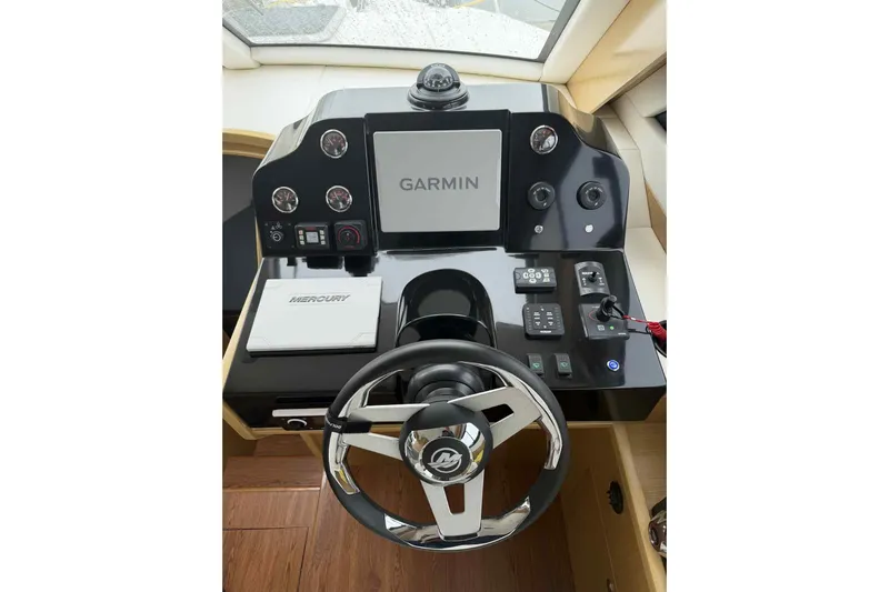  Yacht Photos Pics Helm of 2025 Bracewell Commander 36SF with Garmin navigation and Mercury controls.