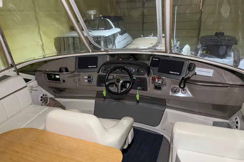 Allegedly Yacht Photos Pics Interior view of 2000 Carver 396 Motor Yacht cockpit with modern navigation equipment.