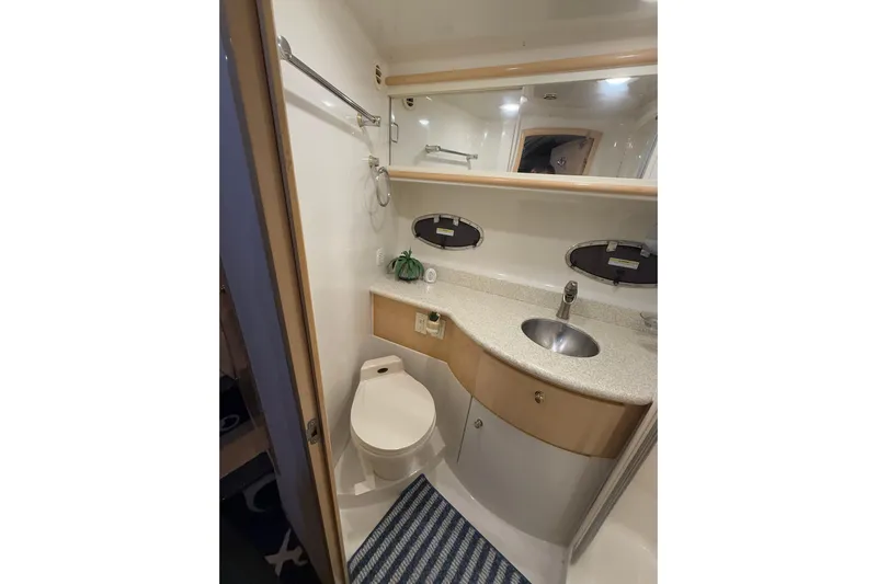 Allegedly Yacht Photos Pics Bathroom interior of 2000 Carver 396 Motor Yacht with sink and toilet.