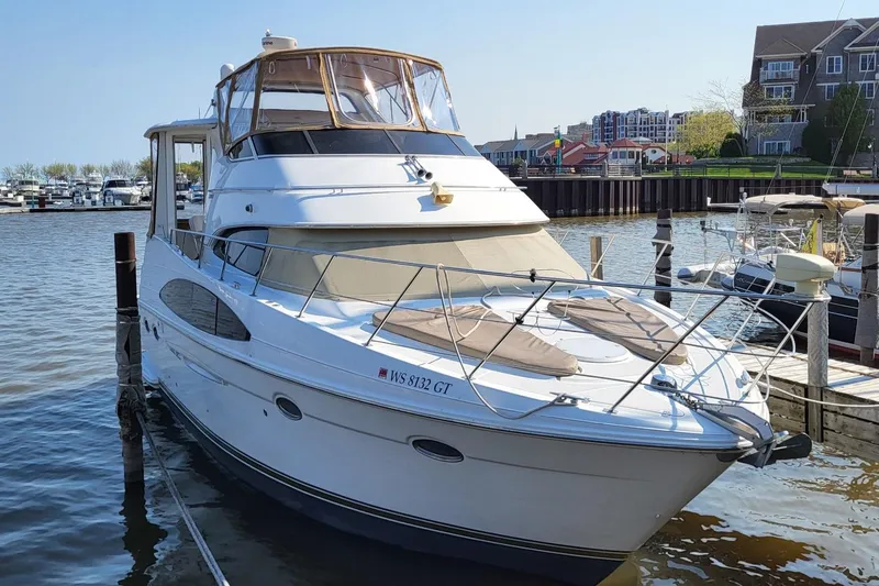 Allegedly Yacht Photos Pics 2000 Carver 396 Motor Yacht docked at a marina, sunny day, waterfront view.