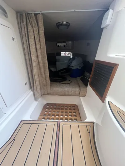  Yacht Photos Pics 2003 Grady-White Express 330 cabin interior with seating and wooden flooring.