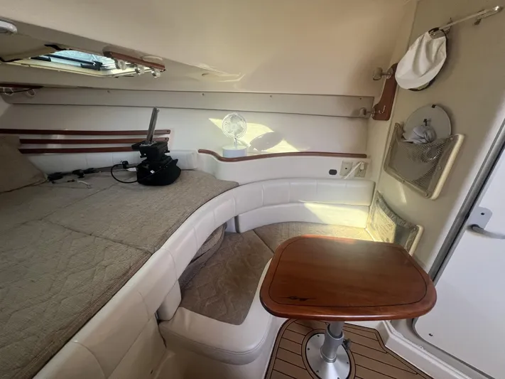  Yacht Photos Pics 2003 Grady-White Express 330 cabin interior with seating and table.